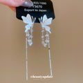 Silver Tone Butterfly Crystal Tassel Earrings with Blue Accents view 1
