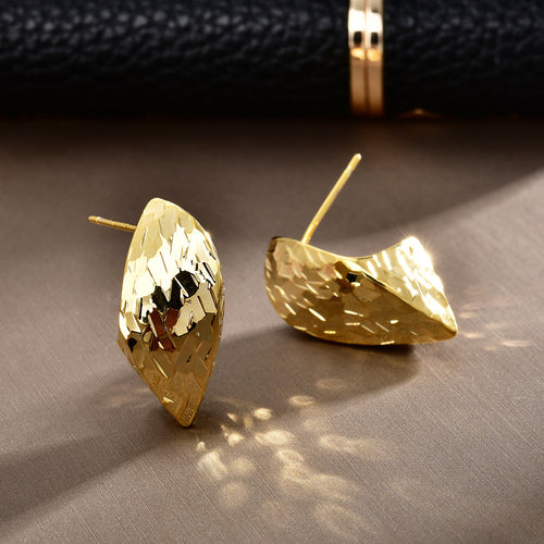 Gold and silver faceted marquise dome studs together