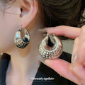 Rounded Ribbed Metal Huggie Hoop Earrings in Two Finishes view 3