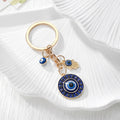 Gold Tone Round Rhinestone Evil Eye and Hamsa Keychains view 2