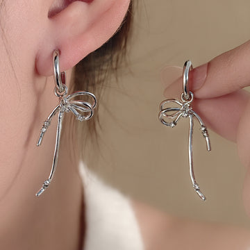 Silver Tone Ribbon Bow Long Dangle Huggie Earrings