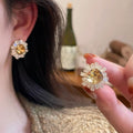 Radiant Crystal Halo Stud Earrings With Polished Metal Tone Details view 2