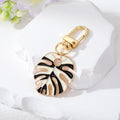 Gold Tone Enamel Monstera Leaf Clip Keychains in Five Colorways view 4
