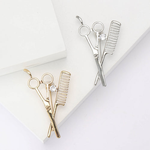 The first image shows the scissors and comb brooch from the front.