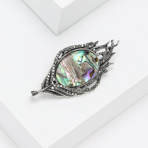 Abalone brooch close-up iridescent shell