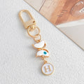 White Enamel Butterfly Evil Eye Letter Charm Gold Keychain view 12