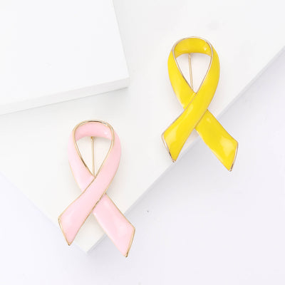 Pink and yellow enamel ribbon brooches pair