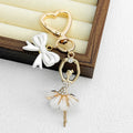 Gold Heart Clasp Charm Keychain With Bow Cherry Accent view 11