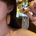 Long Metallic Tassel Drop Earrings in Gold and Silver Tones view 1