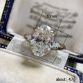 Large Oval Solitaire Three-Stone Ring In Polished Gold Tone view 5