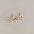 Gold Crystal Bow Huggie Hoop Earrings Pave Charm Drop view 1