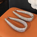 Crystal Pave Teardrop Huggie Earrings With Clear Stone Accents view 3