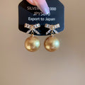 Champagne Pearl and Crystal Bow Stud Earrings with Gold Tone Details view 1