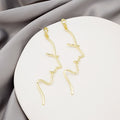 Gold and Silver Abstract Face Line Dangle Earrings view 3