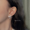 Silver Tone Clear Stone Loop Bow Earrings In Stud And Clip On Styles view 2