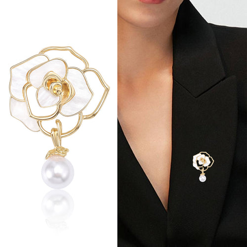 White gold camellia pearl brooch close-up and worn on black blazer