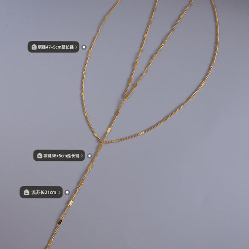 Gold Y lariat necklace flat lay with length measurement labels