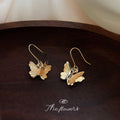 Gold Butterfly Dangle Earrings Textured Wing Metal Hooks view 4