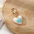Gold Tone Evil Eye Heart Charms with Large Lobster Clasps in Six Designs view 7