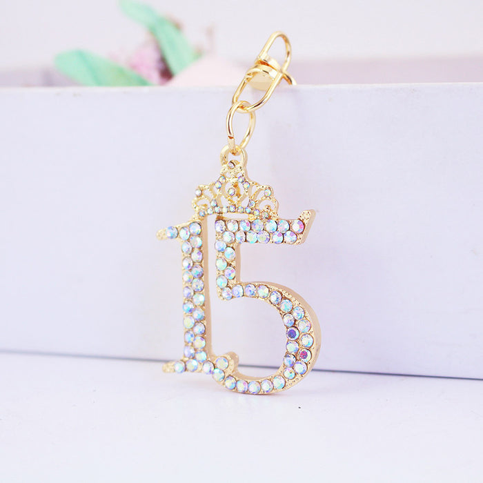 Crowned Number 15 Rhinestone Keychain With Gold Tone Metal