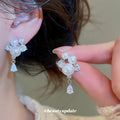Pearl Cluster Teardrop Dangle Stud Earrings With Polished Metal Details view 4