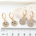 Gold Tone Crystal Smile and Frown Medallion Huggie Earrings view 4