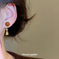 Brown Bead Gourd Drop Stud Earrings With Gold Tone Charms view 3