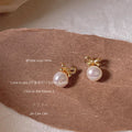 Gold Tone Bow And White Pearlescent Drop Stud Earrings view 2