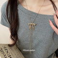 Bow and Ribbon Tassel Necklaces in Gold and Silver Tones view 3