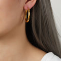 Large Polished Oval O-Hoop Earrings Gold Tone Metal view 1
