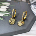 Gold Tone Monstera Leaf Huggie Drop Earrings with Polished Finish view 3