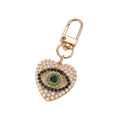 Gold Tone Rhinestone and Faux Pearl Heart Evil Eye Clip Keychains view 5