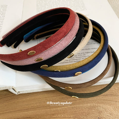 Stack of flocked Love plaque headbands in red pink black beige mustard navy