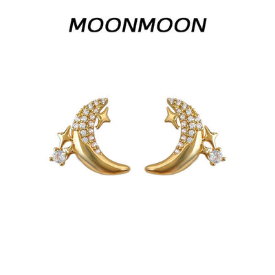 Gold pavé crescent moon star earrings on white with MOONMOON text