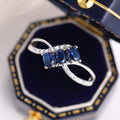 Three Blue Oval Stone Crisscross Ring In Polished Silver Tone view 5