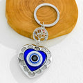 Silver Evil Eye Keychain With Butterfly Heart And Elephant Charm view 10