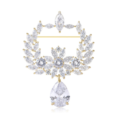 Front view of the crystal olive branch frame brooch in two tones with polished metal detail on a white background