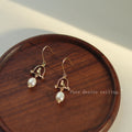 Gold Tone Bird Arch And White Pearl Drop Hook Earrings view 1