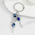 Evil Eye Beaded Tassel Keychain with Leaf Charm Accents view 2