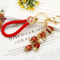 Mixed Red Firecracker Flower Strawberry and Suitcase Fortune Keychains view 3