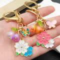 Blossom Bee Butterfly Shell and Bell Flower Keychains view 2