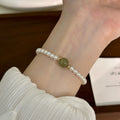 White Pearl Stretch Bracelet Green Jade Center Bead view 4