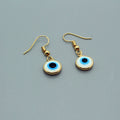 Gold Tone White and Blue Evil Eye Drop Earrings with Hooks view 1