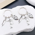 Two Silver Tone Syringe Stethoscope and Heart Keychains view 1