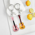 Guitar Shaped Charm Keychain With Star And Flower Pendants view 2