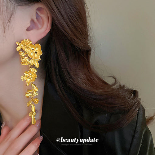 Detail view 2 of gold tone floral vine statement drop earrings statement jewelry