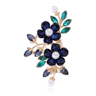 Front view of the navy blossom metal brooch