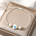 Cord and Pearl Accent Heart Evil Eye Bracelets in Nine Colors view 3