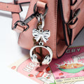 Silver Headphones Keychain Brown Leather Cord Bow Charm view 3
