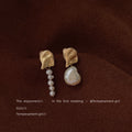 Gold Tone Pleated Top And Asymmetric White Pearl Drop Earrings view 6